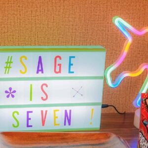 Lightbox with colorful letters spelling "#SAGE IS SEVEN".