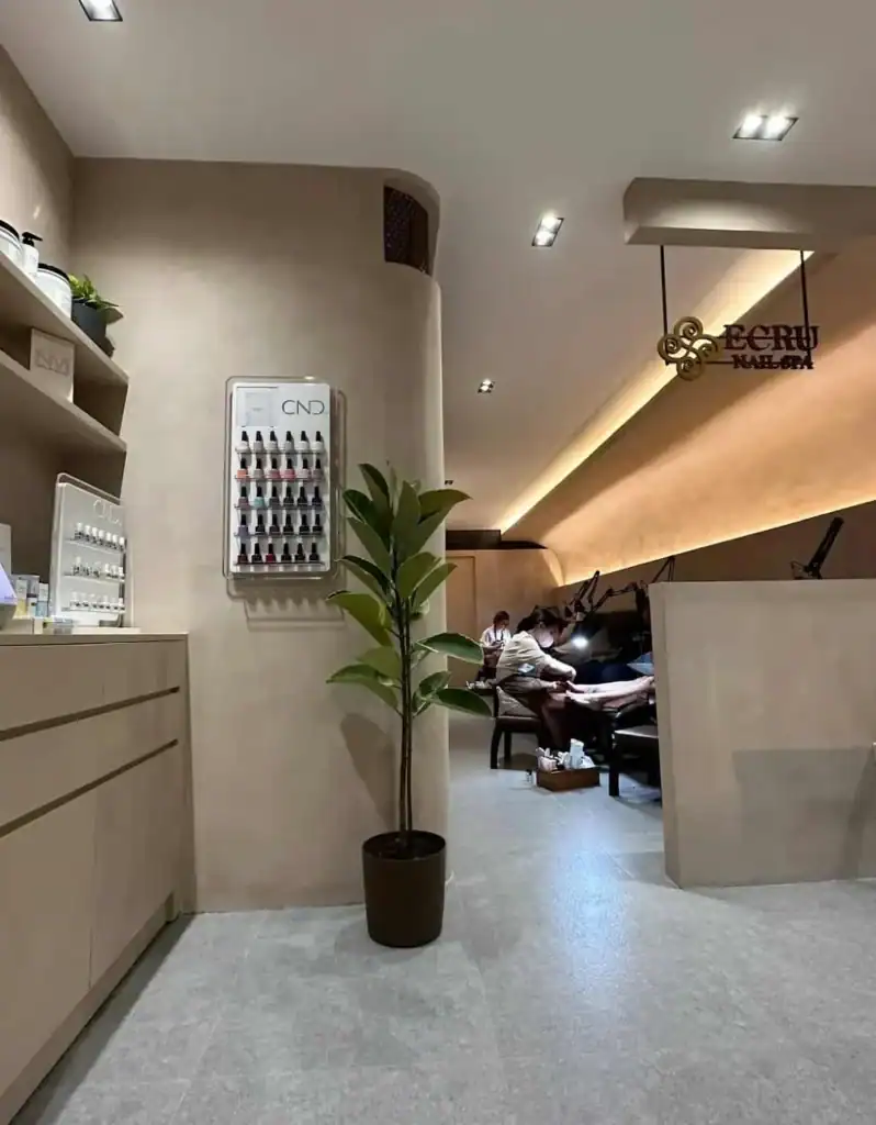 Elegant nail salon interior with modern decor and relaxing ambiance at Ecru Nail Spa.